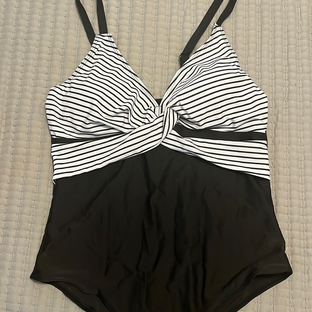 Black and white striped cross cross top, black bottom one piece in XL.